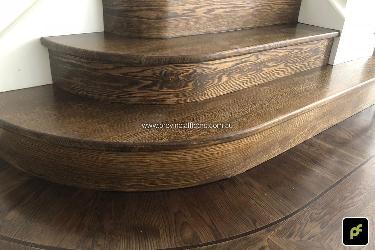 Solid American Oak Staircase Polished. Stained and Finished with a Waterbased Polyurethane. Satin in sheen.