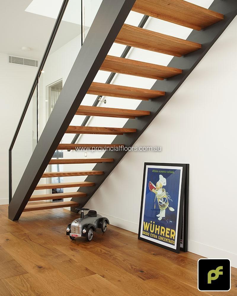 Solid Tasmanian Oak Staircase Polished. Finish with a Custom Coloured Oil/Wax Finish. Matte in sheen.
