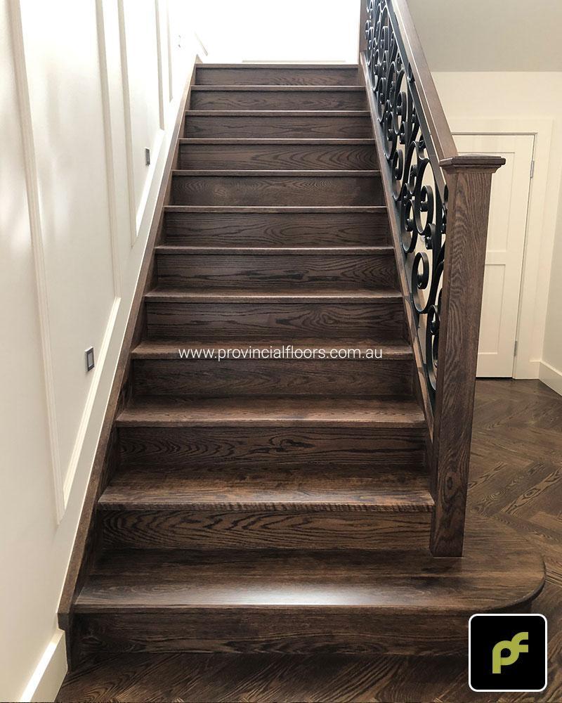 Solid American Oak Staircase Polished. Stained and Finished with a Waterbased Polyurethane. Satin in sheen.