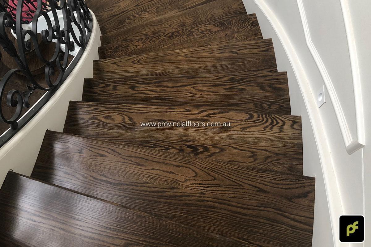 Solid American Oak Staircase Polished. Stained and Finished with a Waterbased Polyurethane. Satin in sheen.