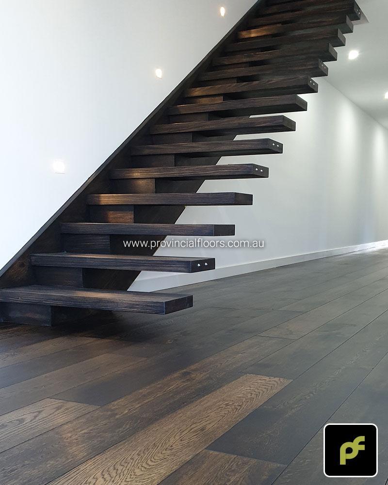 Solid Tasmanian Oak Staircase Polished. Finish with a Custom Coloured Oil/Wax Finish. Matte in sheen.