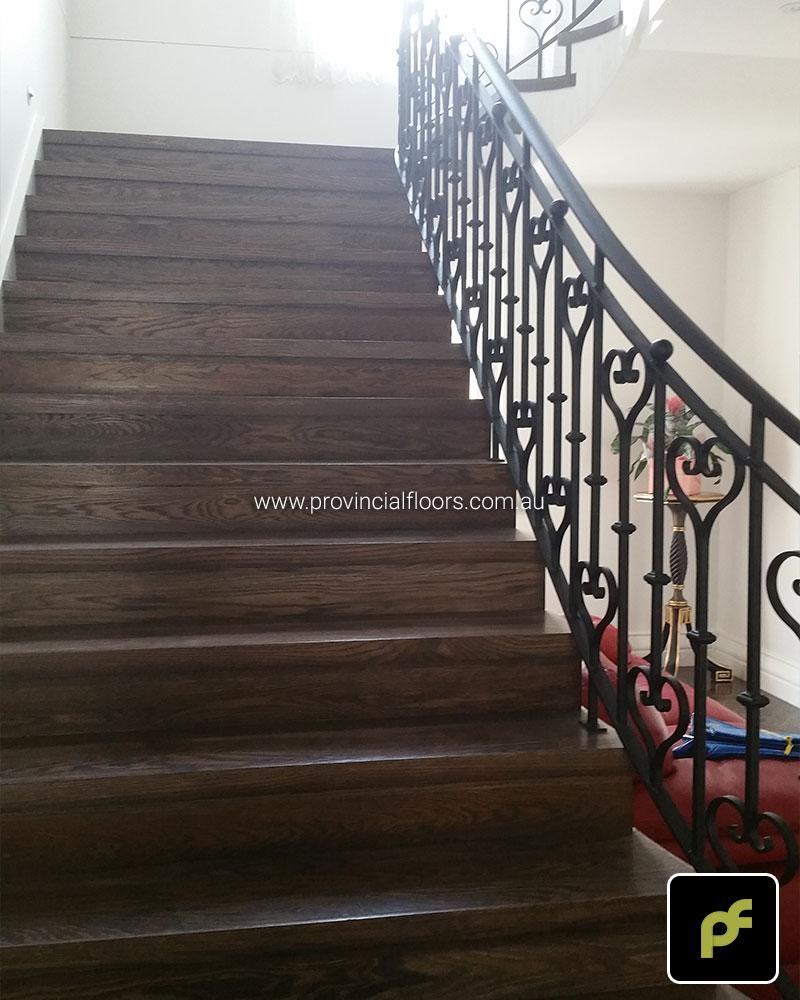 Solid American Oak Staircase Polished. Stained and Finished with a Waterbased Polyurethane. Satin in sheen.