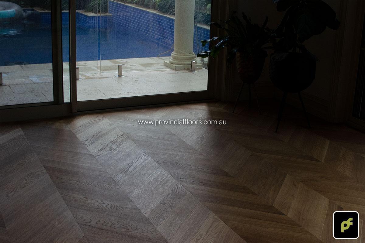 European Oak Chevron Parquetry with a Natural Coloured Oil/Wax Finish. Matte in sheen and easily repairable.