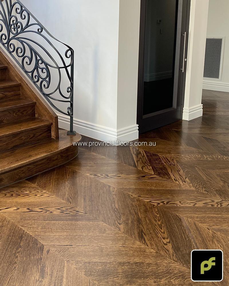 European Oak Chevron Parquetry with a Custom Border Design. Stained and finished with Water-Based Polyurethane. Satin in sheen.