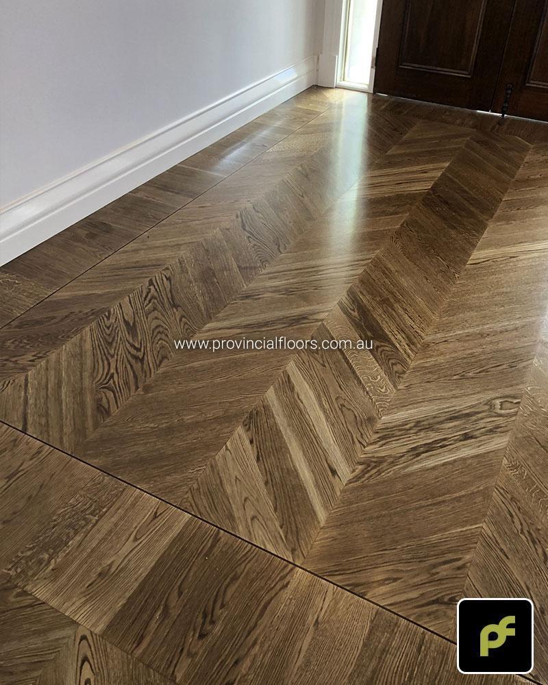 European Oak Chevron Parquetry with a Stained Water-Based Polyurethane Finish. Satin in sheen.