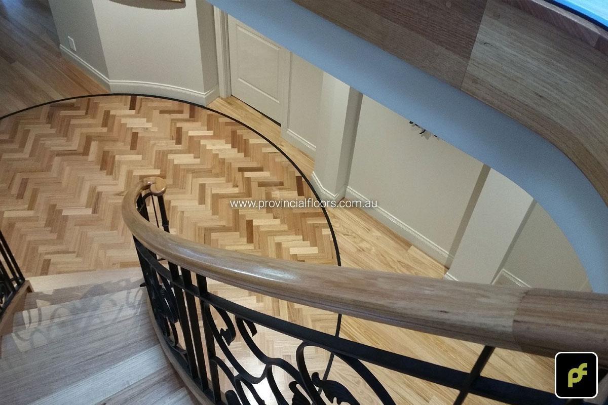 Tasmanian Oak Herringbone Parquetry in a circular border design. With a Water-Based Polyurethane Finish. Satin in sheen.