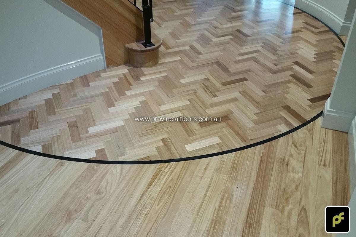 Tasmanian Oak Herringbone Parquetry in a circular border design. With a Water-Based Polyurethane Finish. Satin in sheen.