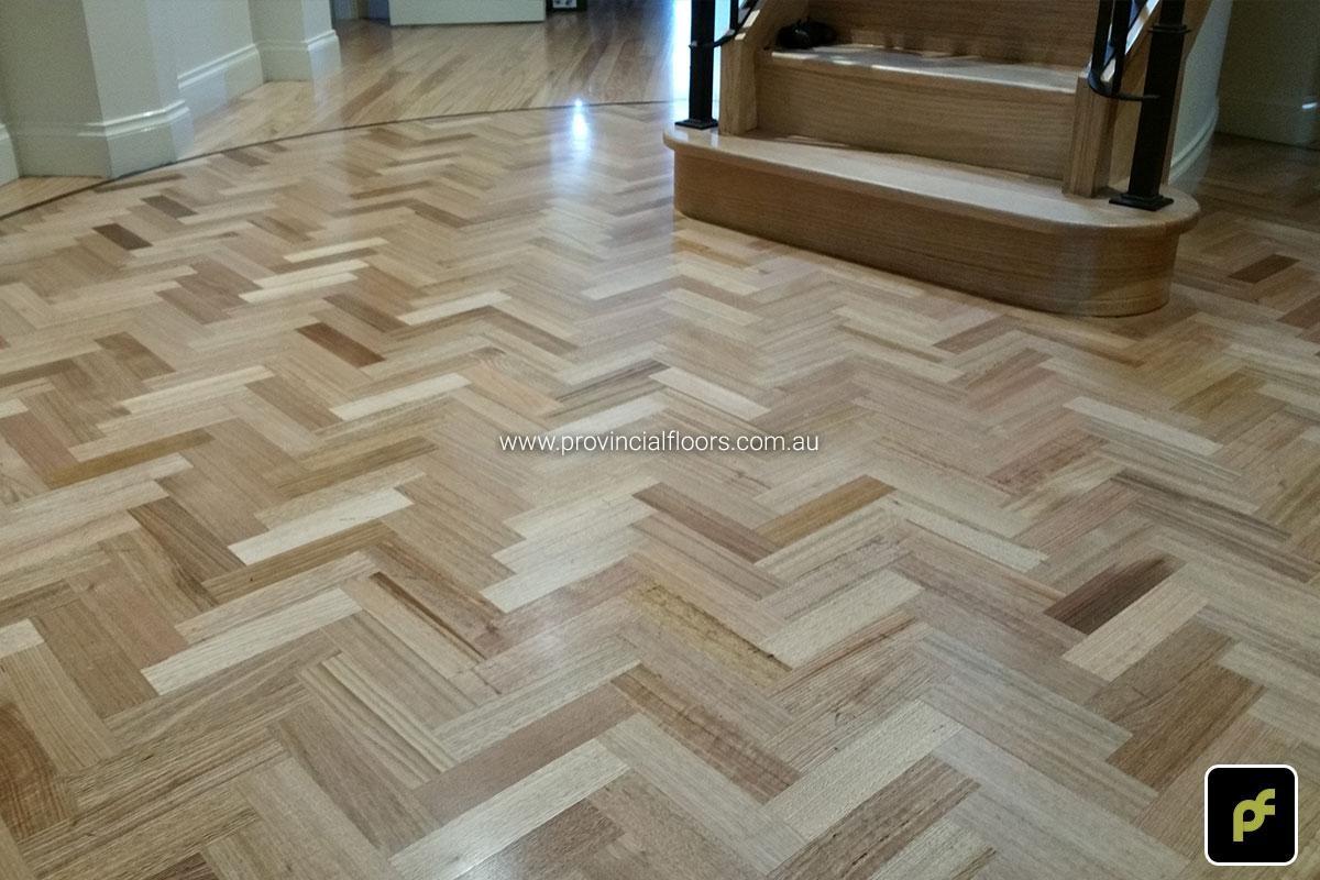 Tasmanian Oak Herringbone Parquetry in a circular border design. With a Water-Based Polyurethane Finish. Satin in sheen.