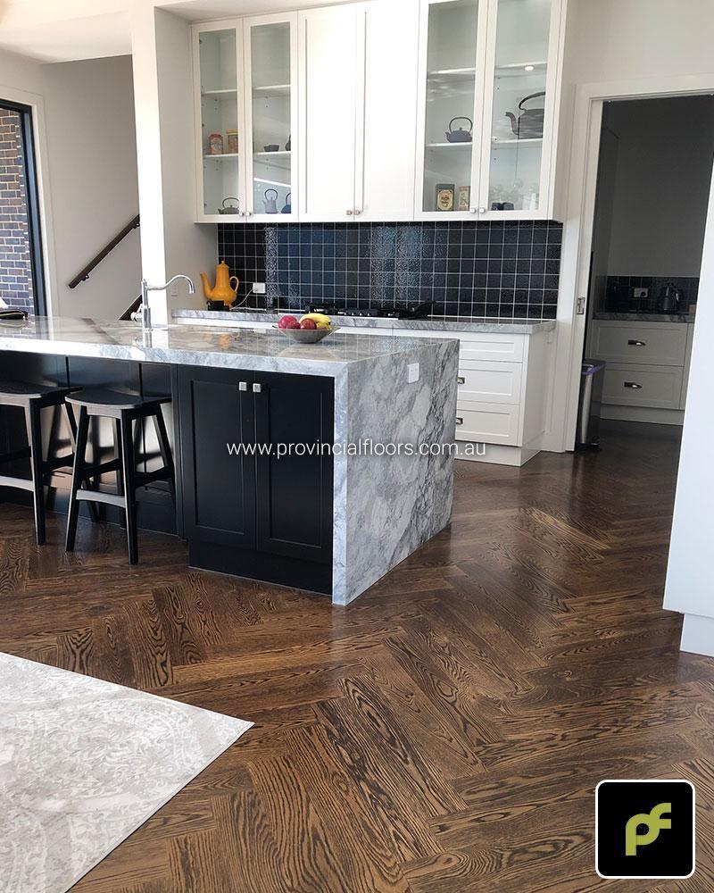 American Oak Herringbone Parquetry with a Stained Water-Based Polyurethane Finish. Satin in sheen.