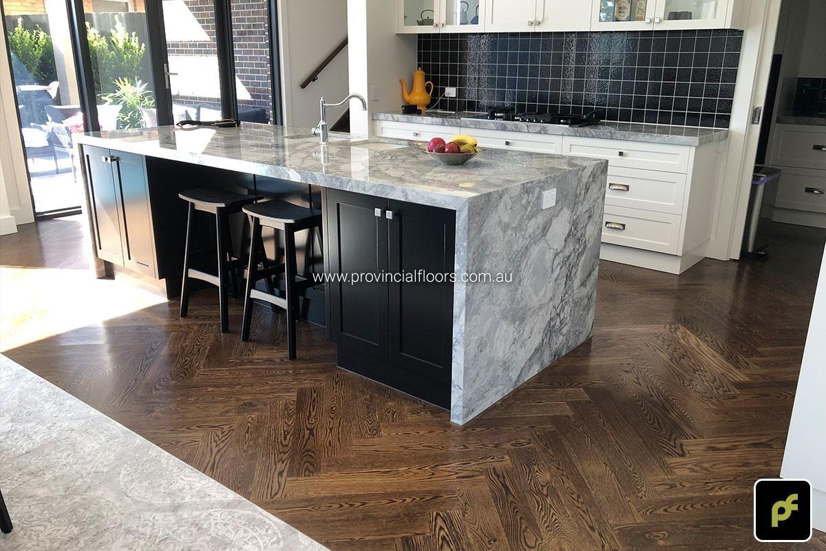 American Oak Herringbone Parquetry with a Stained Water-Based Polyurethane Finish. Satin in sheen.