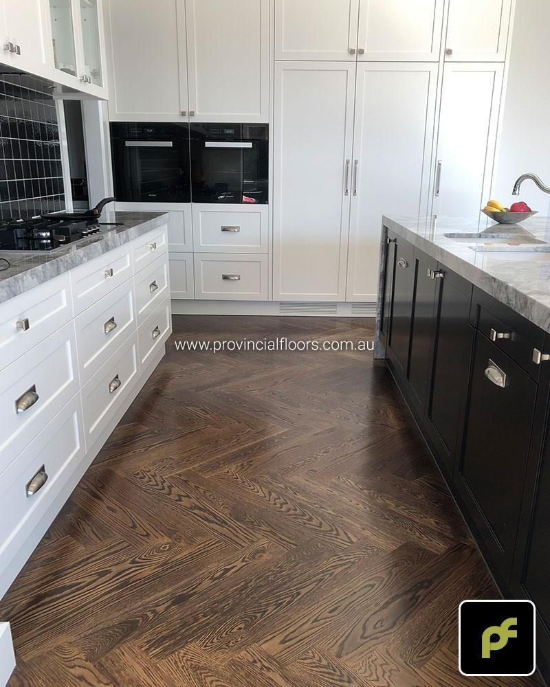 American Oak Herringbone Parquetry with a Stained Water-Based Polyurethane Finish. Satin in sheen.