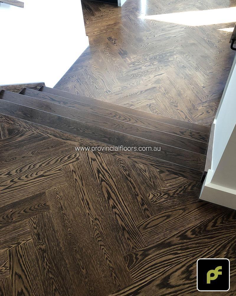 American Oak Herringbone Parquetry with a Stained Water-Based Polyurethane Finish. Satin in sheen.
