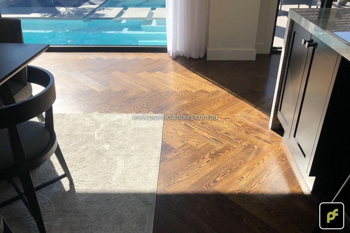 American Oak Herringbone Parquetry with a Stained Water-Based Polyurethane Finish. Satin in sheen.
