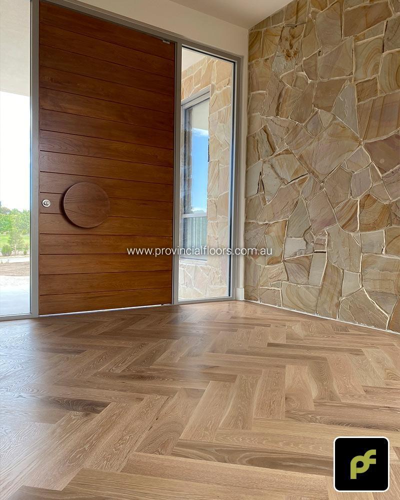 Solid American Oak Herringbone Parquetry with Custom Border Designs. With a Custom Coloured Oil/Wax Finish. Matte in sheen and easily repairable.