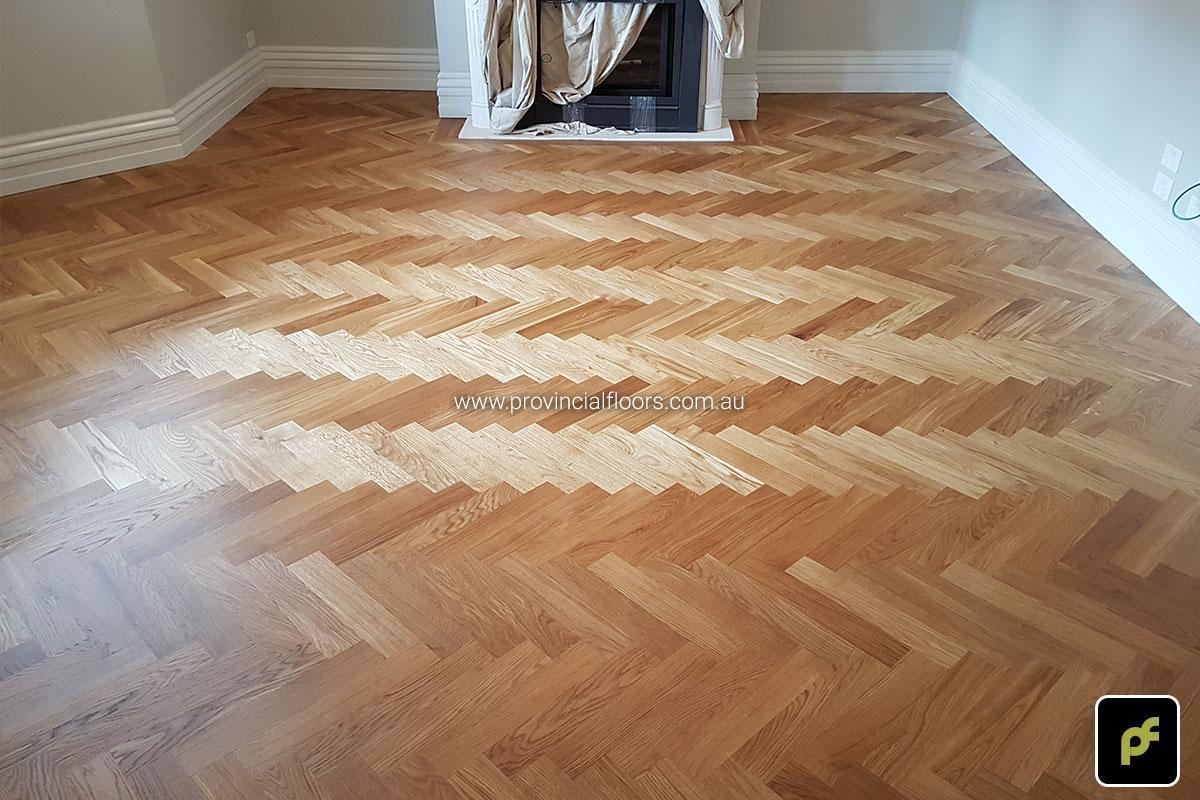 European Oak Herringbone Parquetry with a Jarrah border design feature. With a Natural Coloured Oil/Wax Finish. Matte in sheen and easily repairable.