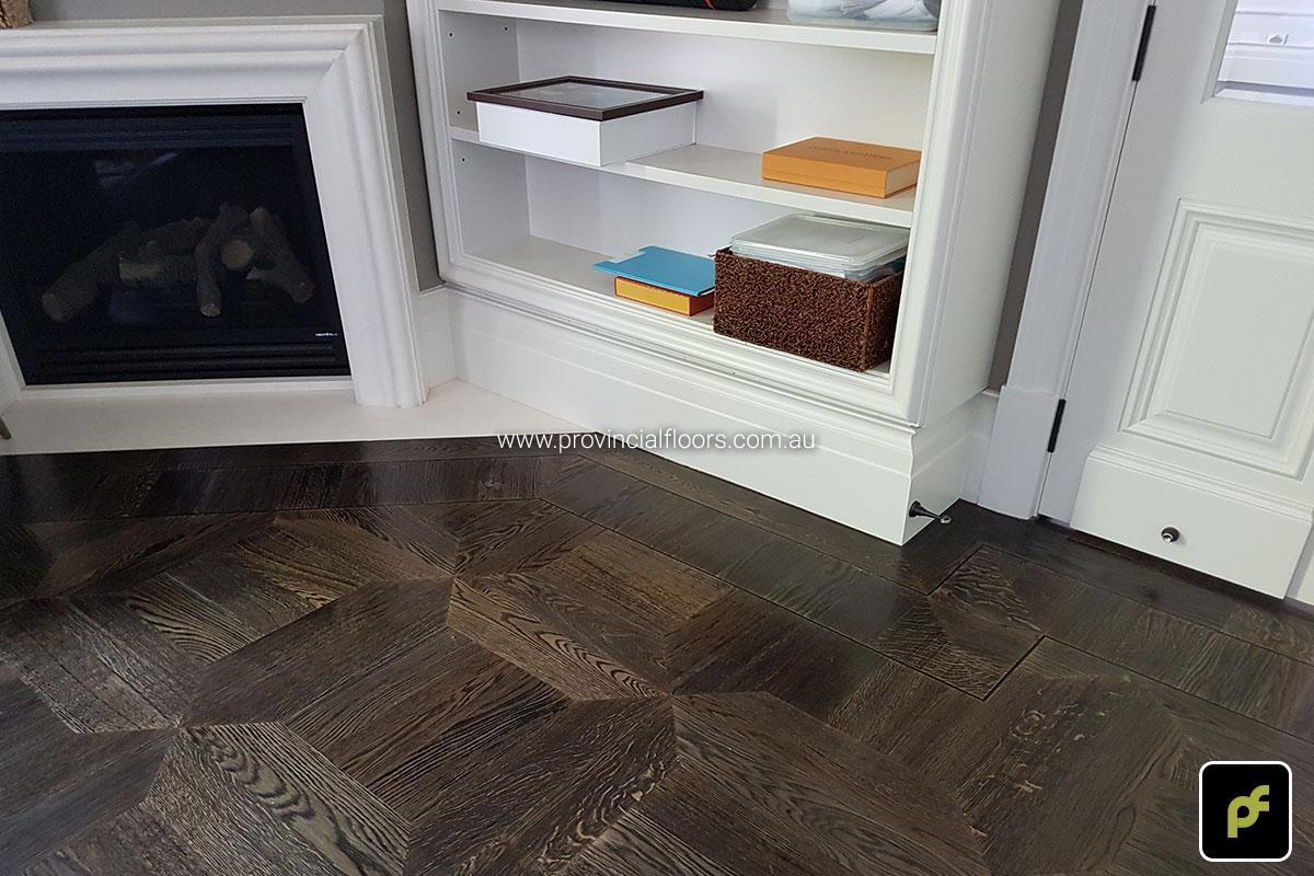 American Oak hand-made Monticello Paneled Parquetry with circumnavigating border designs. With a Stained Water-Based Polyurethane Finish. Satin in sheen.