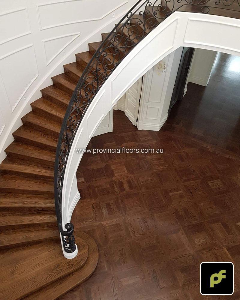 American Oak hand-made Monticello Paneled Parquetry with circumnavigating border designs. With a Stained Water-Based Polyurethane Finish. Satin in sheen.