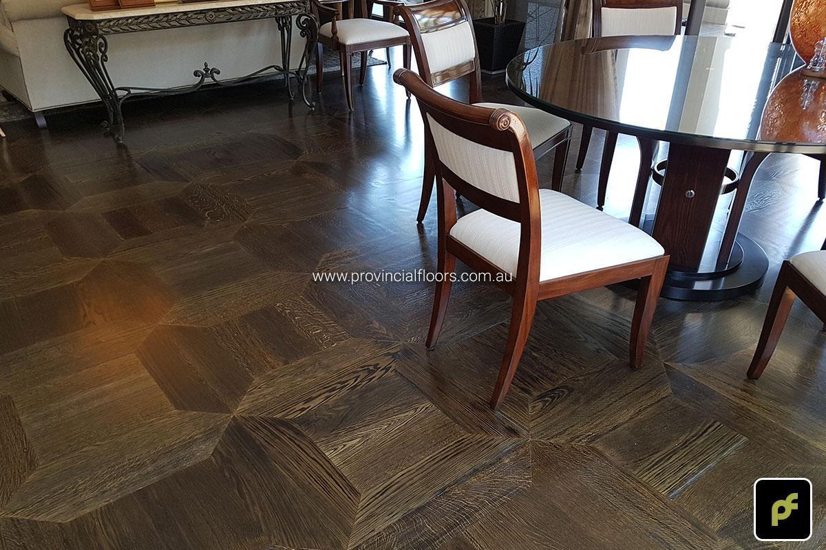 American Oak hand-made Monticello Paneled Parquetry with circumnavigating border designs. With a Stained Water-Based Polyurethane Finish. Satin in sheen.