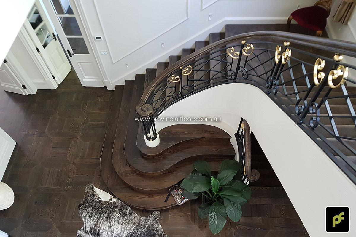 American Oak hand-made Monticello Paneled Parquetry with circumnavigating border designs. With a Stained Water-Based Polyurethane Finish. Satin in sheen.