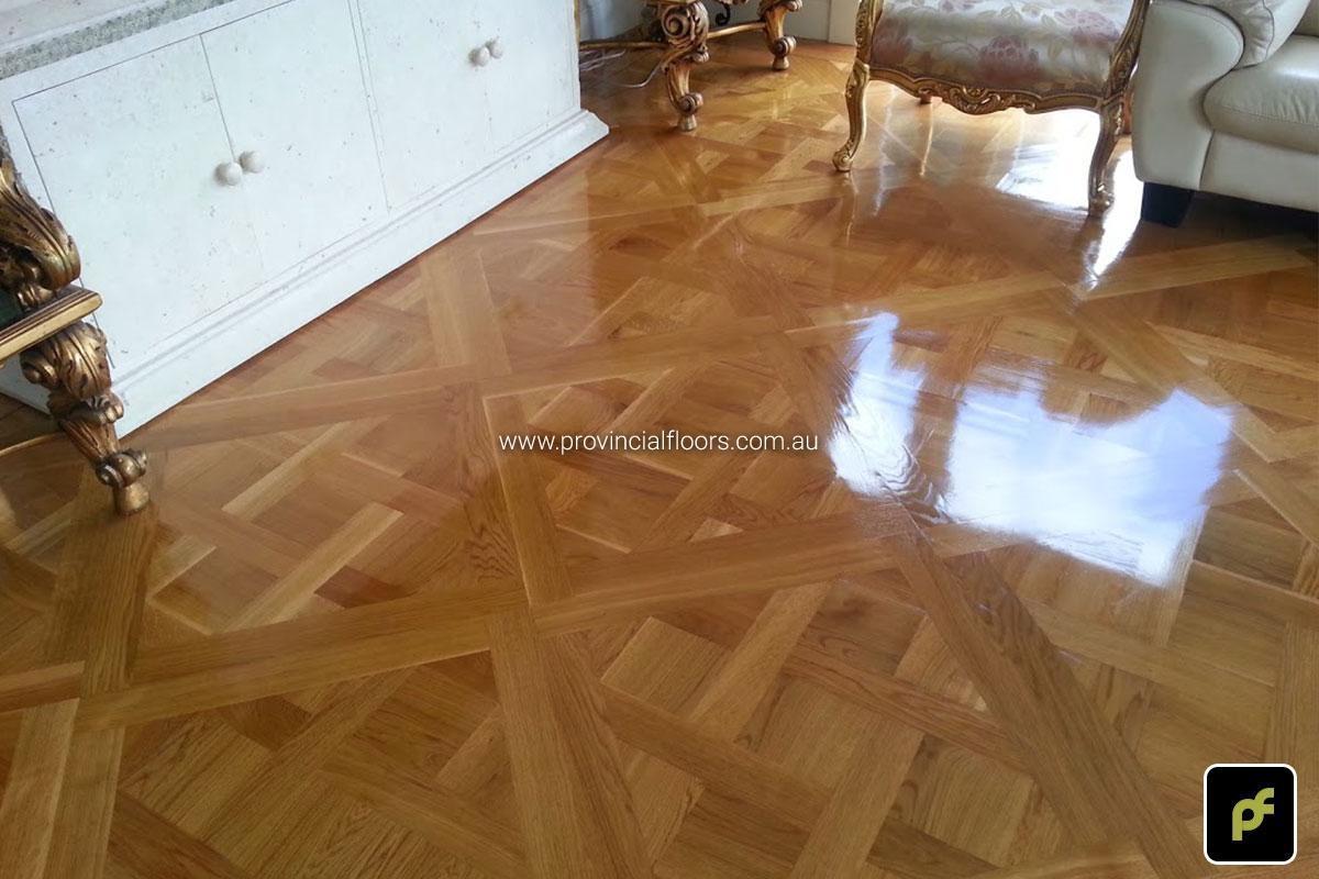 French European Oak Versailles Parquetry Panels with a circumnavigating border design. With a Solvent-Based Polyurethane Finish. Semi-Gloss in sheen.