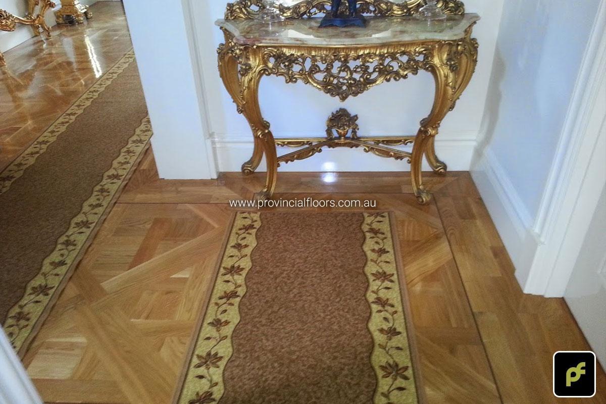 French European Oak Versailles Parquetry Panels with a circumnavigating border design. With a Solvent-Based Polyurethane Finish. Semi-Gloss in sheen.