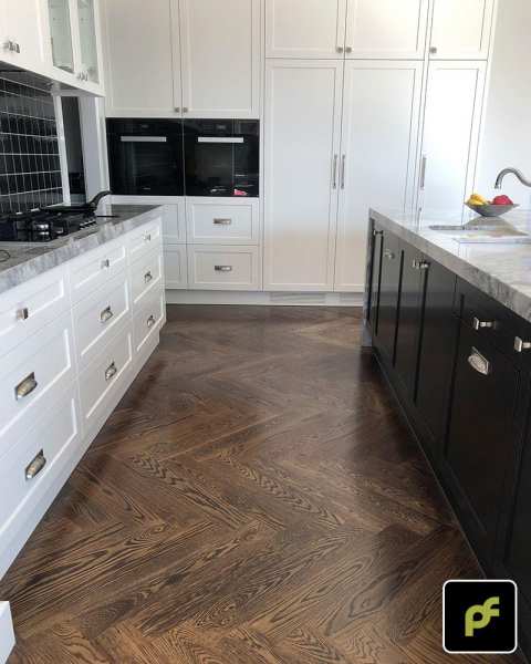 American Oak Herringbone Parquetry with a Stained Water-Based Polyurethane Finish. Satin in sheen.
