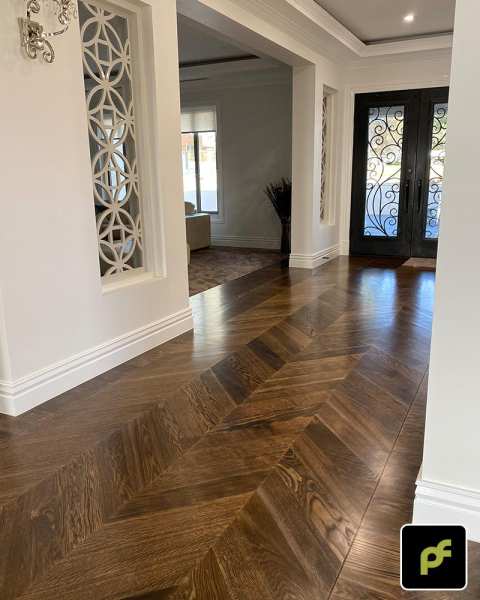 European Oak Chevron Parquetry with a Custom Border Design. Stained and finished with Water-Based Polyurethane. Satin in sheen.