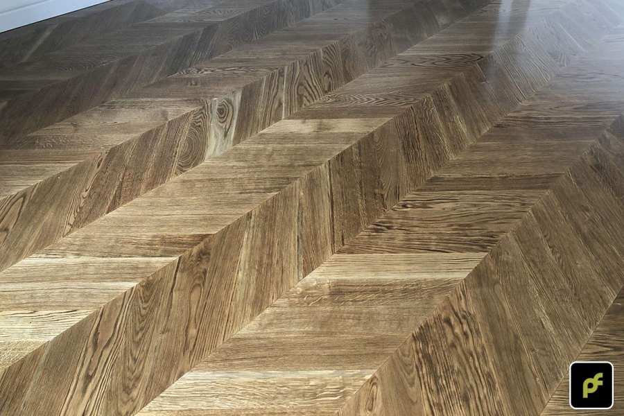 European Oak Chevron Parquetry with a Stained Water-Based Polyurethane Finish. Satin in sheen.