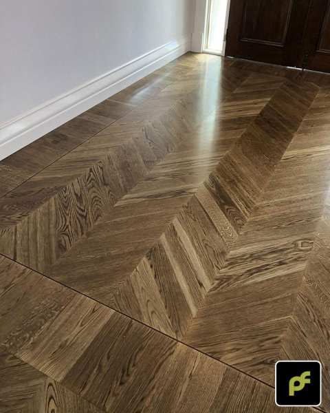 European Oak Chevron Parquetry with a Stained Water-Based Polyurethane Finish. Satin in sheen.