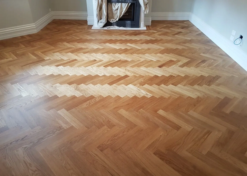 European Oak Herringbone Parquetry Flooring With a Natural Coloured Oil/Wax Finish. Matte in sheen - Bedroom 1