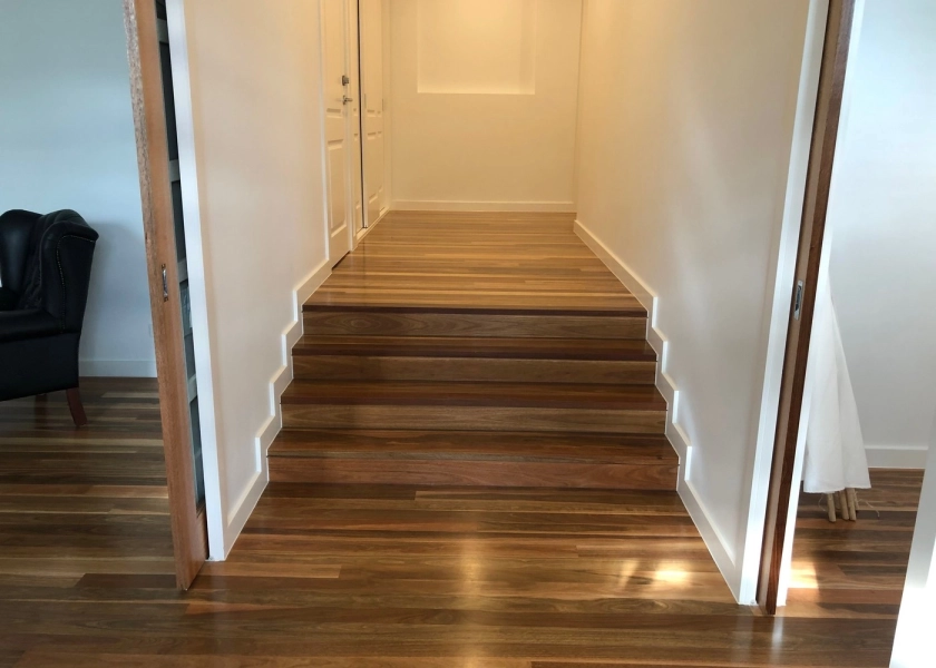 83mm x 14mm Select Grade Spotted Gum Flooring. Finished with Waterbased Coating. Satin in sheen - Hallway Entry