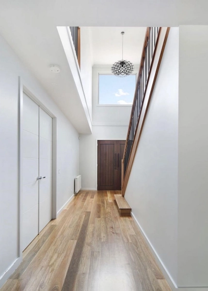130mm x 14mm Select Grade Spotted Gum Flooring. Finished with Waterbased Coating. Satin in sheen - Hallway