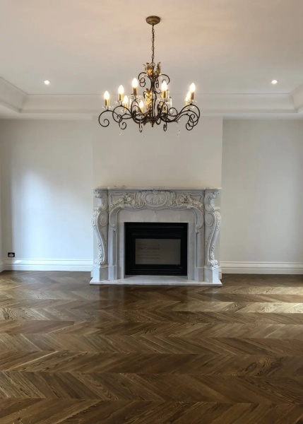 European Oak Chevron Flooring with a Stained Waterbased Coating Finish. Satin in sheen - Fireplace