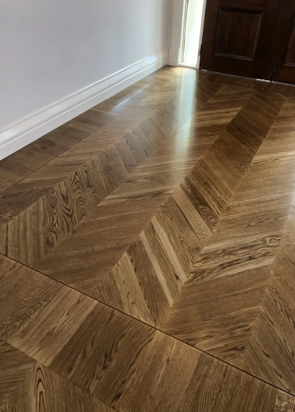 European Oak Chevron Parquetry Flooring with a Stained Waterbased Coating Finish. Satin in sheen - Entry Border Design