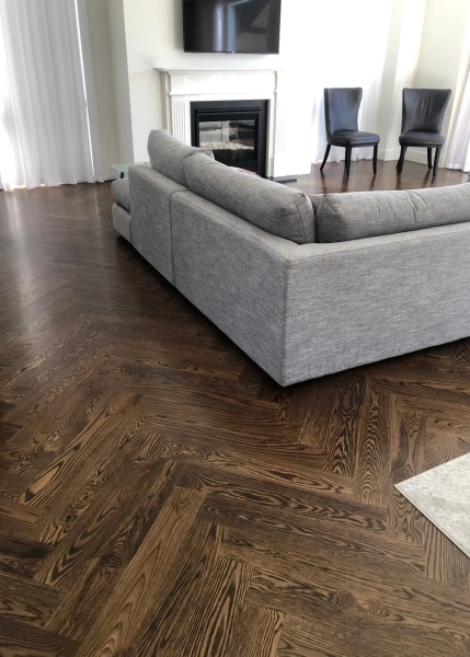 American Oak Herringbone Parquetry Flooring with a Stained Waterbased Coating. Satin in sheen - Living Room