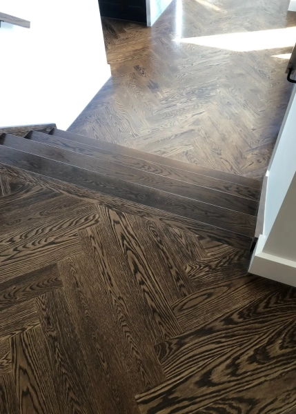 American Oak Herringbone Flooring with a Stained Waterbased Coating. Satin in sheen - Split Level Stairs