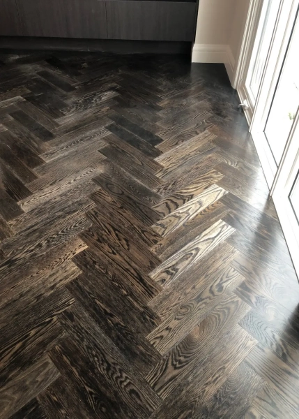 European Oak Herringbone Parquetry Flooring with a Stained Waterbased Coating. Satin in sheen - Sunlight
