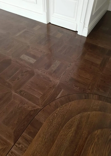 American Oak hand-made Monticello Parquetry Flooring with circumnavigating border designs. With a Stained Waterbased Coating. Satin in sheen - Bottom Level Round Border