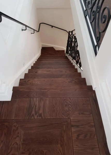 American Oak hand-made Monticello Flooring with circumnavigating border designs. With a Stained Waterbased Coating. Satin in sheen - Second Staircase with Border