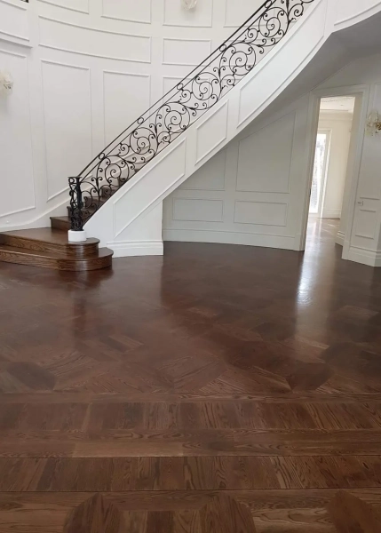 American Oak hand-made Monticello Parquetry Flooring with circumnavigating border designs. With a Stained Waterbased Coating. Satin in sheen - Entry Passage