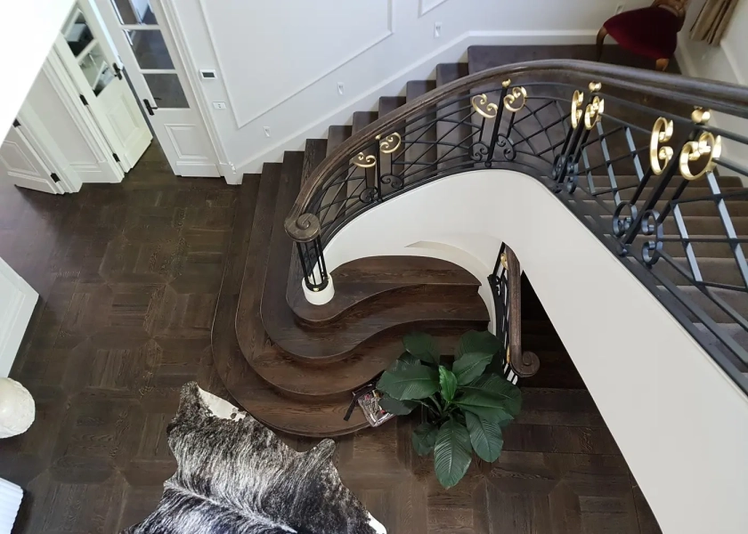 American Oak hand-made Monticello Parquetry Flooring with circumnavigating border designs. With a Stained Waterbased Coating. Satin in sheen - Birds Eye Stairs
