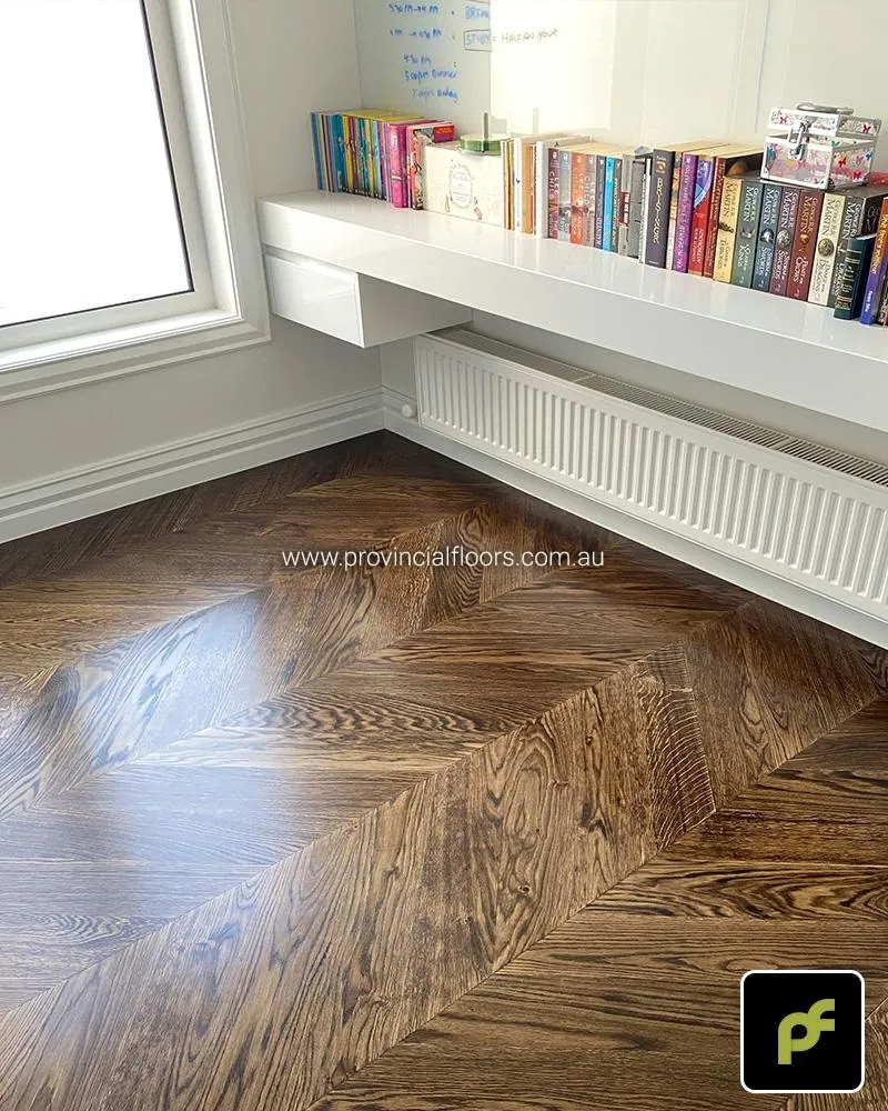 European Oak Chevron Parquetry with a Custom Border Design. Stained and finished with Water-Based Polyurethane. Satin in sheen.