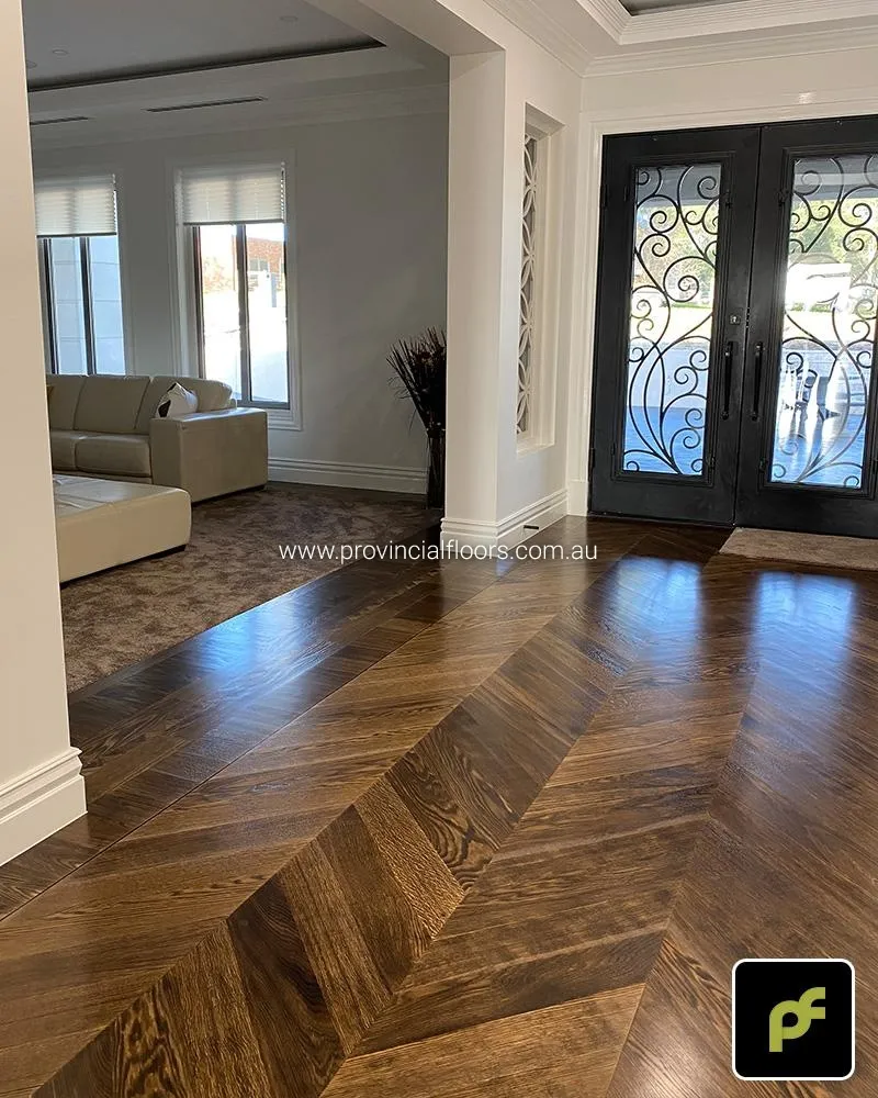 European Oak Chevron Parquetry with a Custom Border Design. Stained and finished with Water-Based Polyurethane. Satin in sheen.