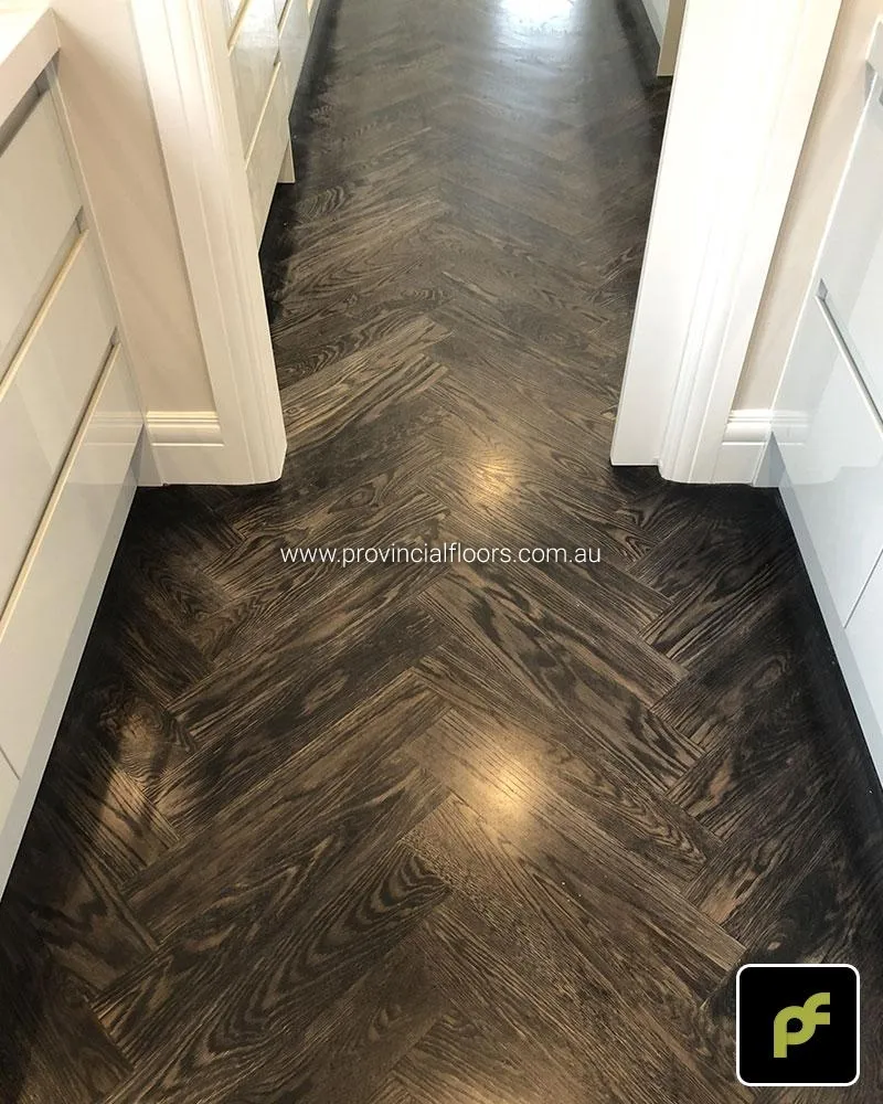 European Oak Herringbone Parquetry with a Stained Water-Based Polyurethane Finish. Satin in sheen.