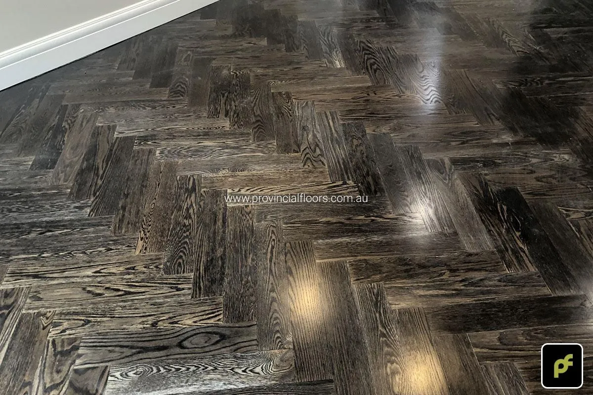 European Oak Herringbone Parquetry with a Stained Water-Based Polyurethane Finish. Satin in sheen.