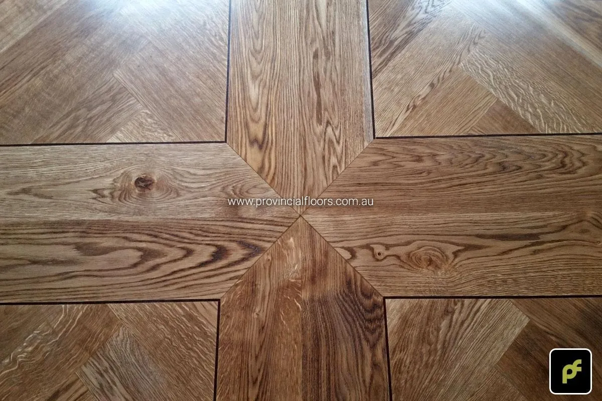 European Oak Herringbone Parquetry with a quadrant border design. With a Stained Water-Based Polyurethane Finish. Satin in sheen.